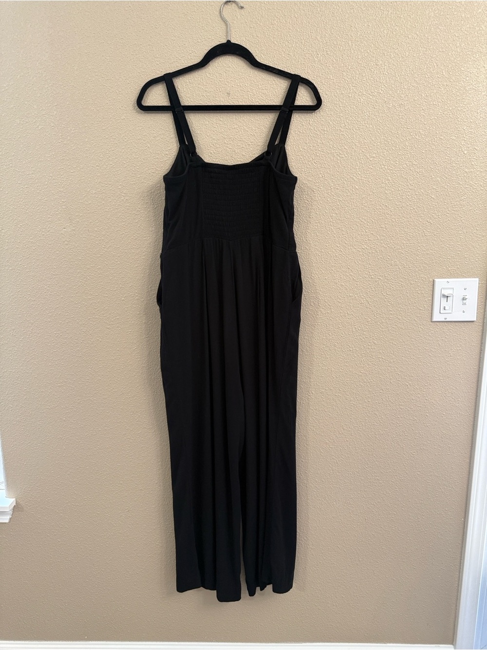 Black Sleeveless one piece jumper with pockets smocked bodice size 0 Torrid